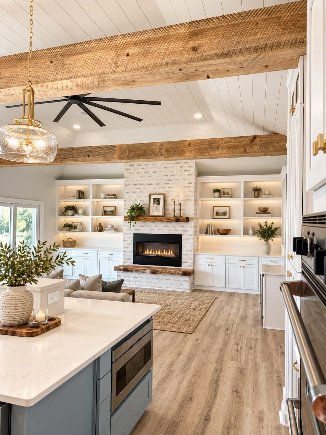 Renovated Gulf Breeze living room from the kitchen island, fireplace wall and built-ins beyond, virtually staged
